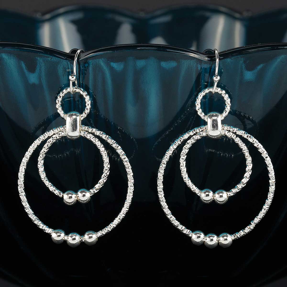 EARRINGS TWISTED DOUBLE CIRCLE 1.5IN X 2IN SHINY SILVER